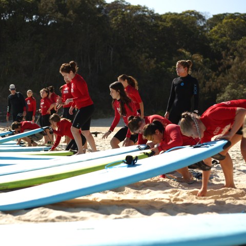 A group of groms getting ready to head out on the water
